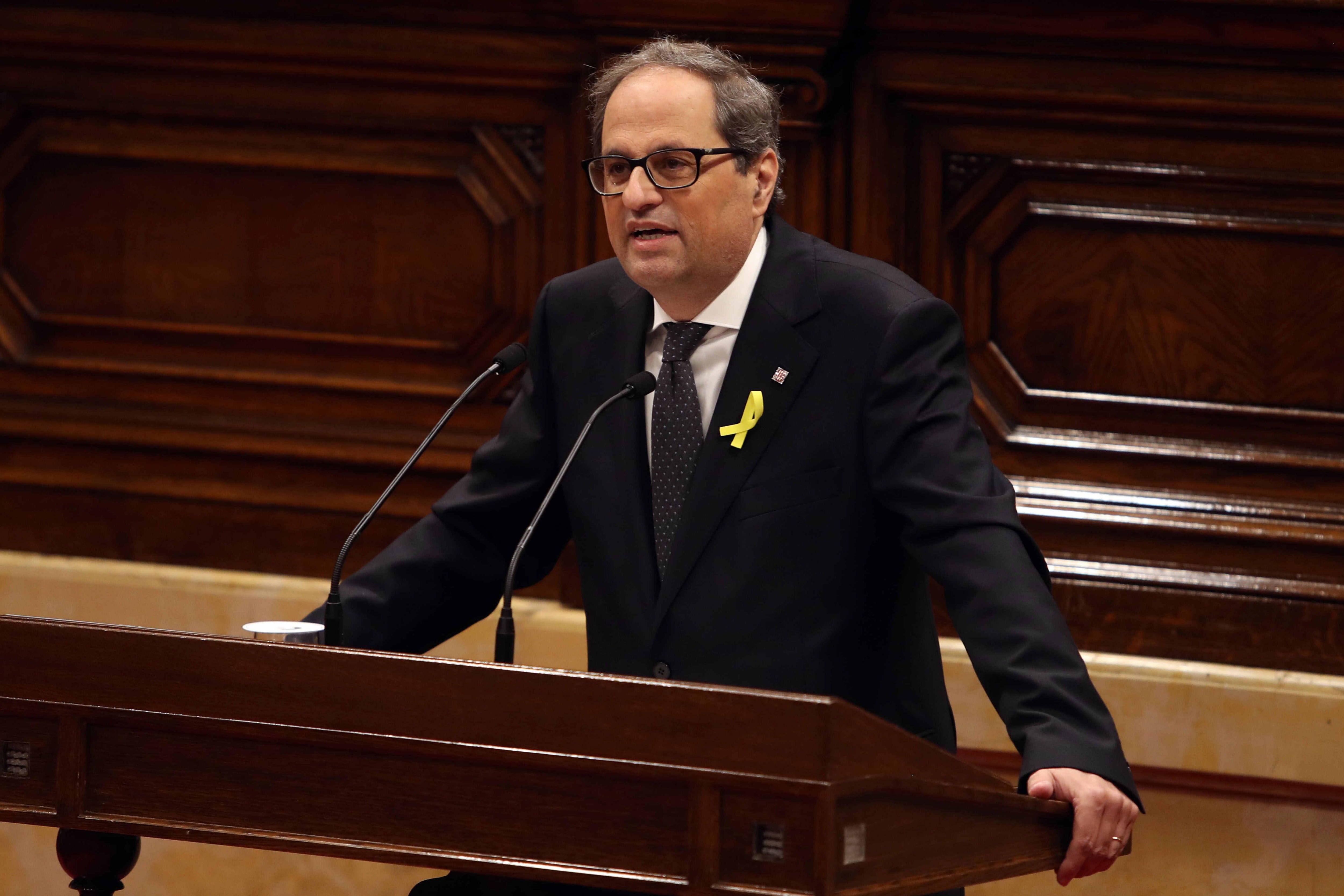 Presidente do governo regional da Catalunha forma executivo com detidos e exilados